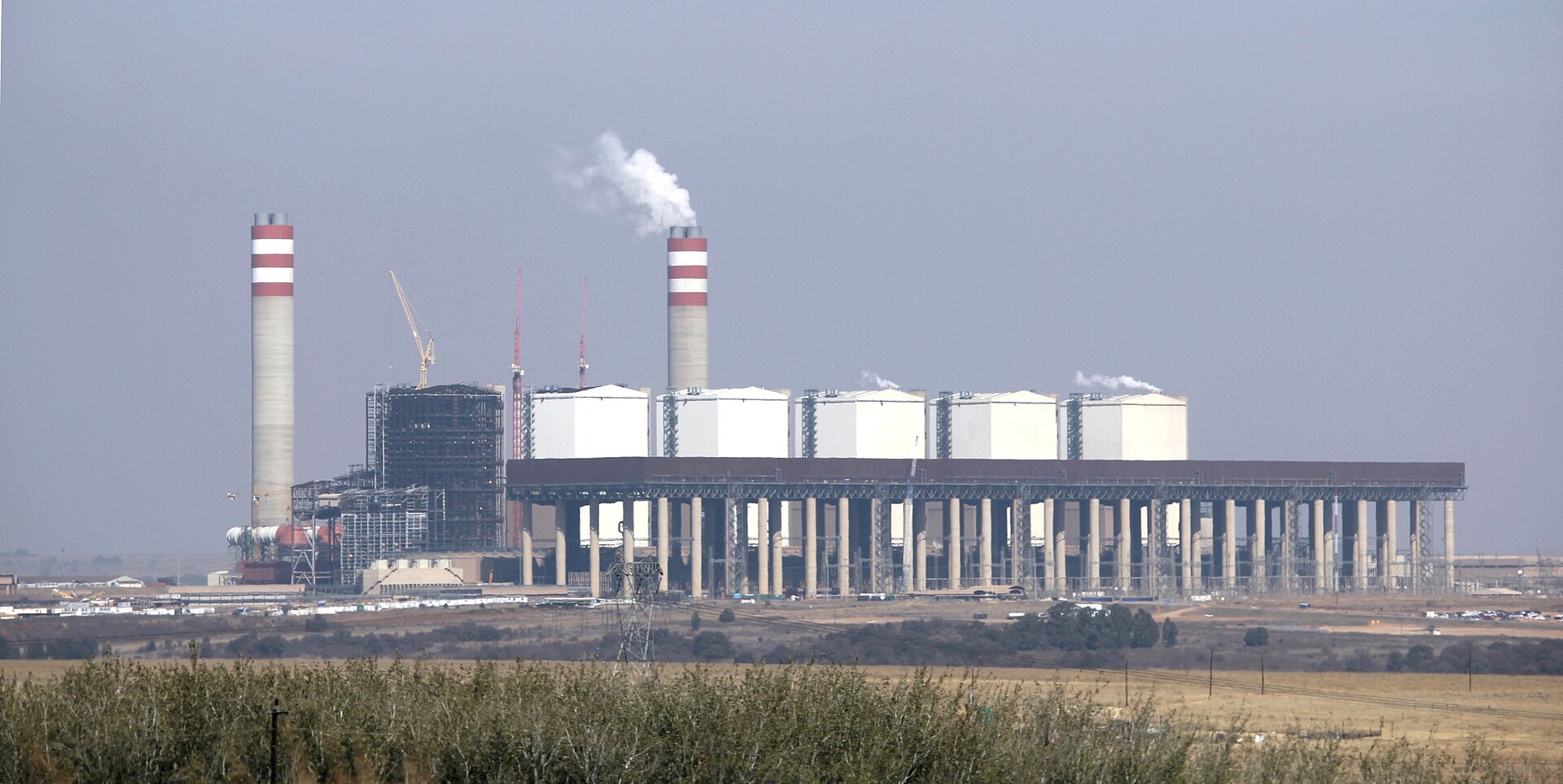Kusile Power Station, Mpumalanga · Photo by JMK, CC BY-SA 4.0, via Wikimedia Commons Kusile Power Station under construction on the Mpumalanga highveld